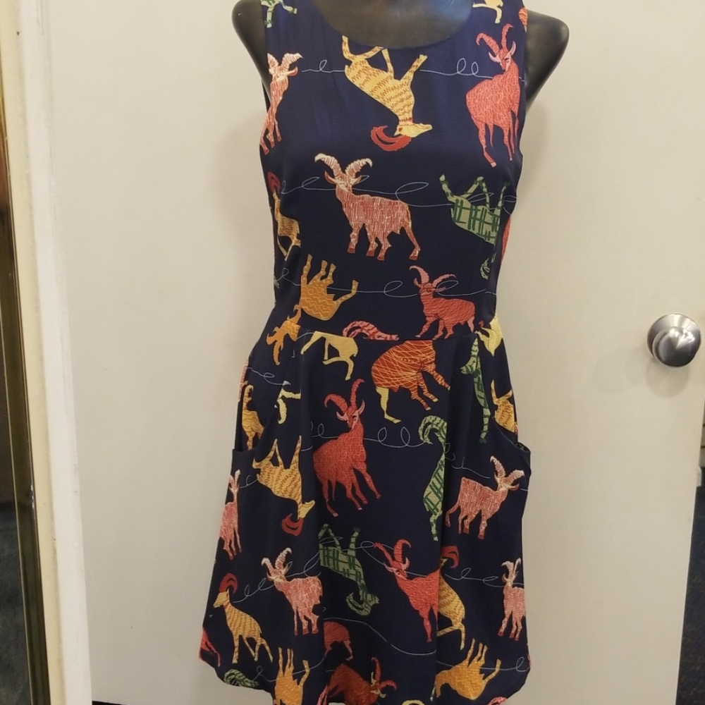 Mini dress with ram print.
